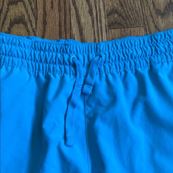 Bright turquoise with white side stripe Nike shorts with pockets, size women’s L - Picture 10 of 16